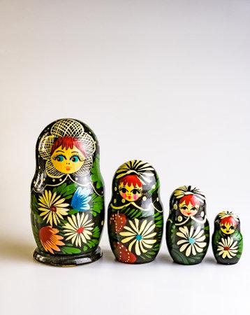 Four Matryoshkas, Russian wooden doll on a white background. Painted with flowers. Vertical.の写真素材