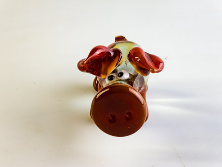 Glass figurine of a pig on a white background. Clear and red glass.の写真素材