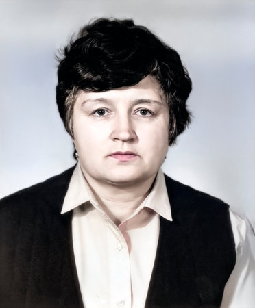 Vintage portrait of attractive middle-aged woman dressed in a strict style. Retro photo from 1990.の写真素材