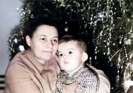 Retro portrait of a grandmother with her grandson near the New Year tree. USSR, Ukraine, Dnepropetrovsk - circa 1970.の写真素材