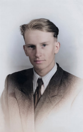 Vintage portrait of a young blond man in a formal suit and tie. Retro photograph from 1956.の写真素材
