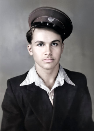 Vintage portrait of a handsome young man in a school uniform. Bogoroditsk, USSR. Retro photo from 1955.の写真素材