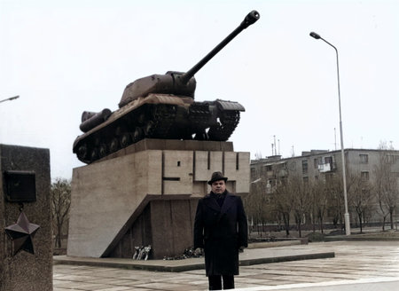 A vintage portrait of a middle-aged man wearing hat and coat in Dnipropetrovsk, Ukrainian SSR....