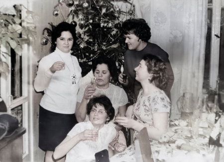 Minsk, Byelorussian SSR, USSR - December 27, 1959: Vintage portrait of Soviet women friends at the New Year's table. Retro photo.のeditorial素材