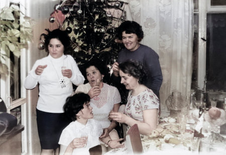 Minsk, Byelorussian SSR, USSR - December 27, 1959: Vintage portrait of Soviet women friends at the New Year's table. Retro photo.のeditorial素材