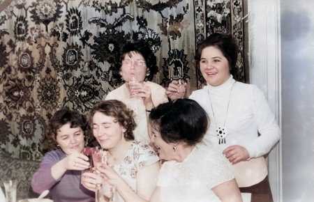 Minsk, Byelorussian SSR, USSR - December 27, 1959: Vintage portrait of Soviet women friends at the New Year's table. Retro photo.のeditorial素材