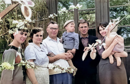 Chasov Yar, Ukrainian SSR, USSR - May 15, 1968: Vintage portrait of a three-generation family in a spring garden. Retro photo from 1968.のeditorial素材