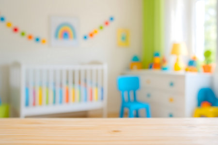 Natural light wood table top provides a clean surface, with a cheerful, out-of-focus childrens nursery in the background. Colorful decor and toys create a playful atmosphere.の素材