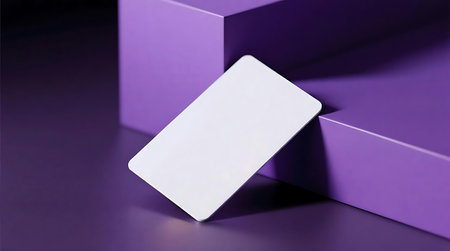 Clean, blank white card with rounded edges, elegantly propped against a backdrop of purple geometric cubes Modern composition highlighted by soft shadows, perfect for mockup designsの素材