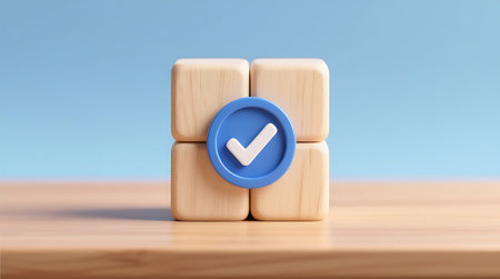 Four natural wooden blocks display a prominent blue checkmark symbol, signifying completion or approval They rest on a light wood surface against a soft blue backgroundの素材