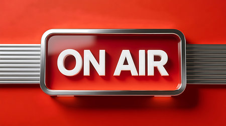 Bright ON AIR sign, 3D white letters on a vibrant red panel with a sleek metallic frame Represents live broadcasting and studio activityの素材
