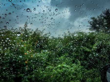 Blurred backgroud with rain water drops on window