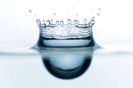 Close-up of the crown of water splashing in the water formed after the fall of the dropの写真素材