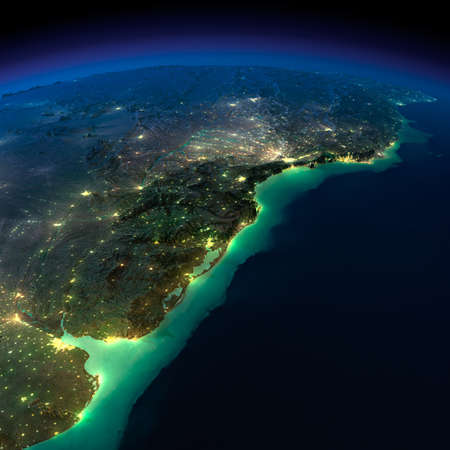 Highly detailed Earth, illuminated by moonlight  The glow of cities sheds light on the detailed exaggerated terrain and translucent water of the oceans の写真素材