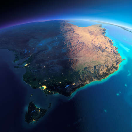 Highly detailed planet Earth. Night with glowing city lights gives way to day. The boundary of the night & day. Australia and Tasmania. Elements of this image furnished by NASAの写真素材