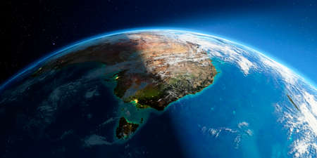 Highly detailed Earth with atmosphere, exaggerated relief and light-flooded cities. Transition from night to day. Australia and Tasmania. 3D rendering.の写真素材