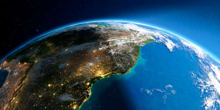 Highly detailed Earth with atmosphere, exaggerated relief and light-flooded cities. Transition from night to day. South America. East Coast of Brazil. 3D rendering.の写真素材