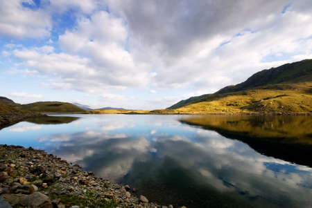 Beautiful mountain lake at sunsetの写真素材