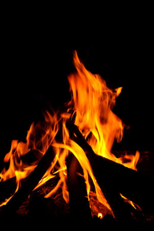 An intense log burning fire with red hot flamesの写真素材