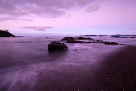 Sunrise on a beautiful rocky coastlineの写真素材