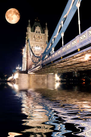 Tower Bridge, London at night reflected in the Thamesの写真素材