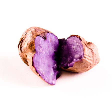 single purple potato on a white backgroundの写真素材