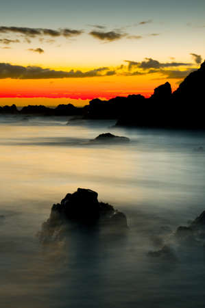 Magical view of sunrise over a misty oceanの写真素材