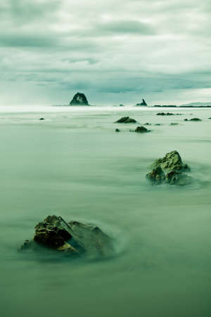 View over the coast on a mystical moment with clouds and mistの写真素材