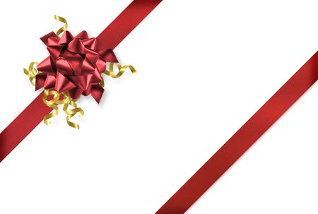 Diagonal red and gold gift wrap ribbon on white backgroundの写真素材