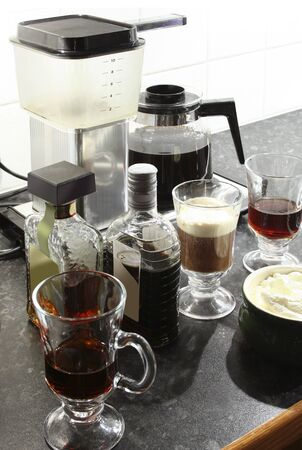 Hot almond liqueur shots with coffee and whipped creamの写真素材