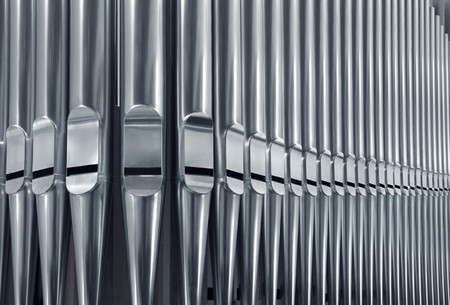 Close-up of modern steel organ pipe set horizontalの写真素材