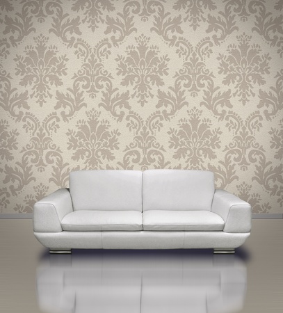 Modern white leather sofa in light damask pattern stucco wall roomの写真素材