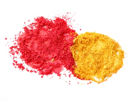 Red and yellow color powder dust isolated on white backgroundの写真素材