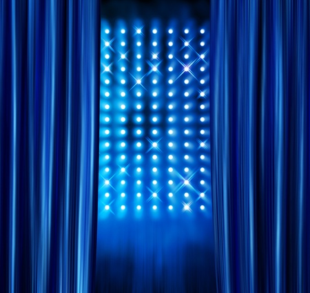 Blue satin curtains reveal stage spotlight lamps wallの写真素材
