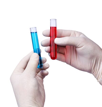 Chemist hands holding liquids in test tubes, isolated on whiteの写真素材