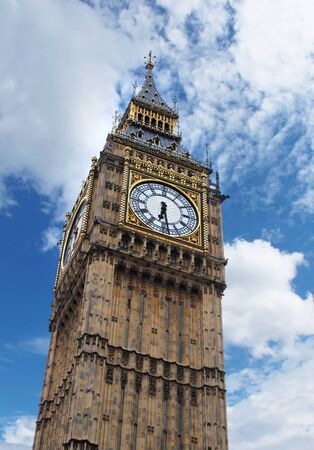 Big Ben clock tower in Westminster London, against blue sky white cloudsの写真素材