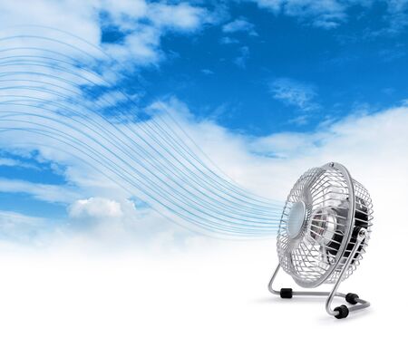 Electric fan blowing fresh air stream blue sky backgroundの写真素材