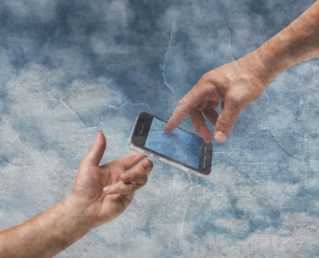 Two hands God and Adam reaching mobile phone old painting styleの写真素材