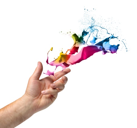 Creativity concept, hand throwing color paint splash isolated on whiteの写真素材