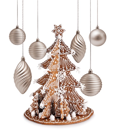 Decorative gingerbread tree and warm silver Christmas decoration ballsの写真素材