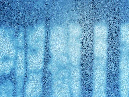 Beautiful ice crystal pattern in frosty windowの写真素材