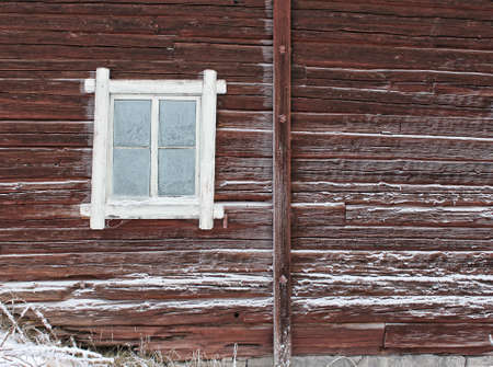 Frosty window of old log home, winter season backgroundの写真素材