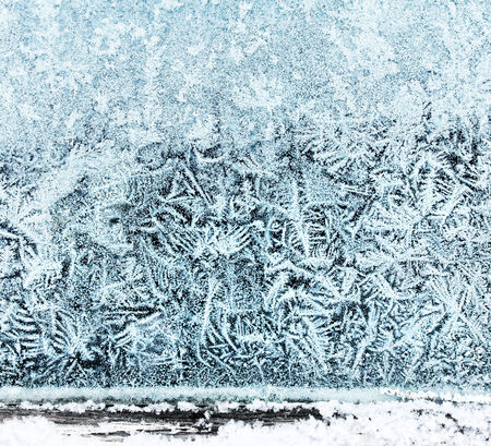 Frosty window beautiful ice crystal pattern backgroundの写真素材