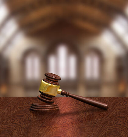 Judges gavel on courthouse table, justice conceptの写真素材