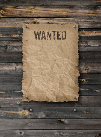 Wild West wanted poster on weathered plank wood wallの写真素材