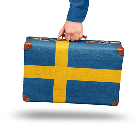 Vintage Swedish flag suitcase isolated on white visit Finland conceptの写真素材