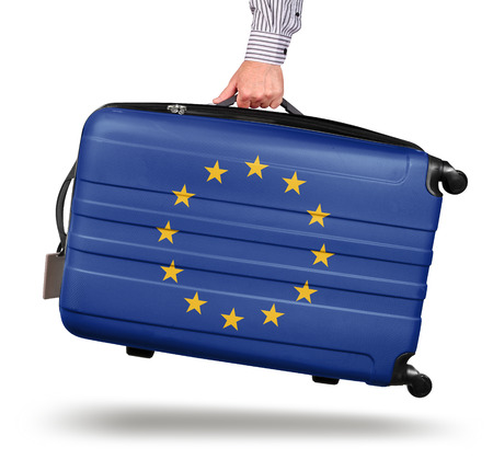 Hand holding modern suitcase European Union flag design isolated on whiteの写真素材