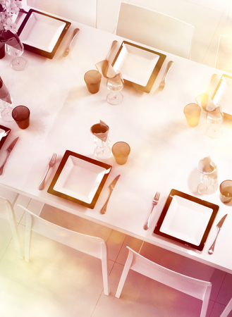 Modern black and white dining table setting seen above with pastel colorsの写真素材