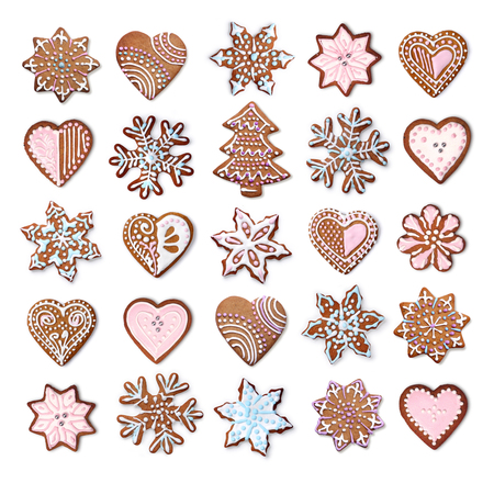 Home made Christmas gingerbread cookies icing decoration collection isolated on whiteの写真素材
