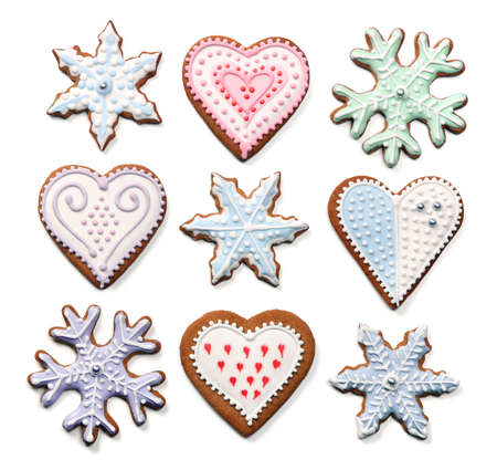 Sweet Christmas gingerbread cookies collection with colorful sugar icing decoration, isolated on white backgroundの写真素材